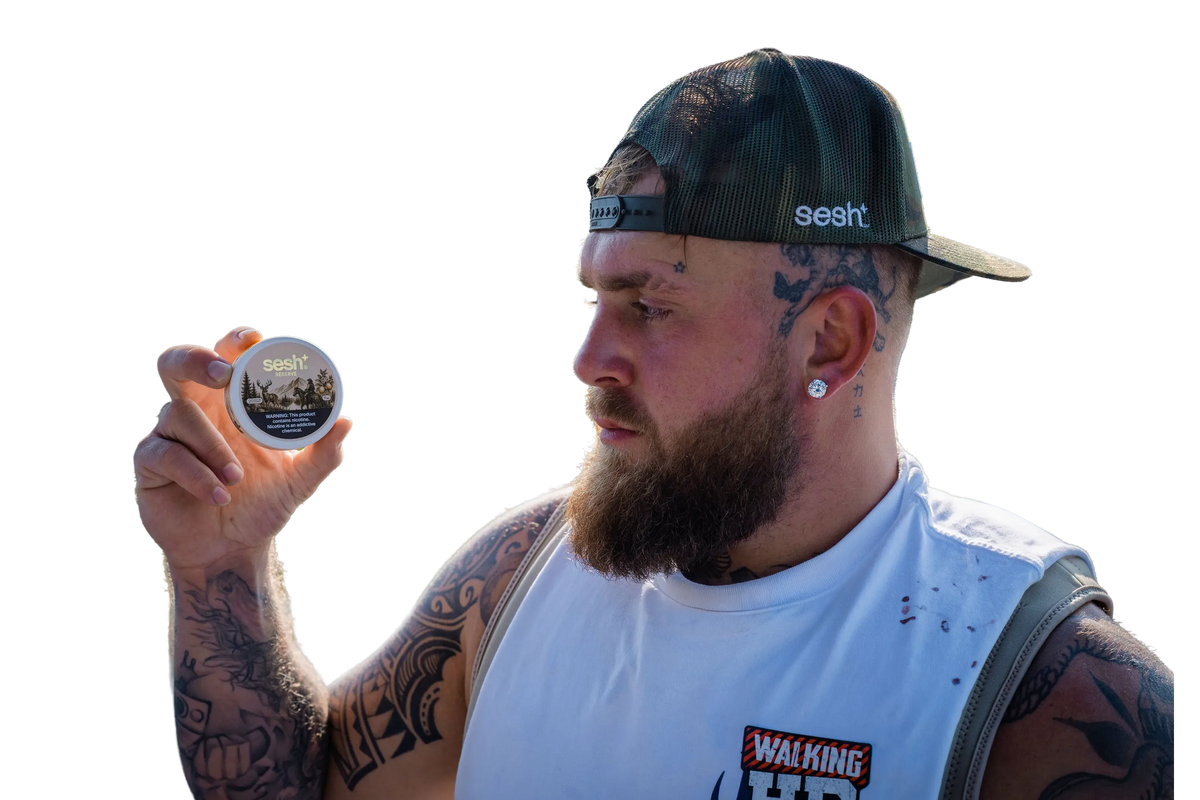 Jake Paul looking at a can of Sesh Reserve