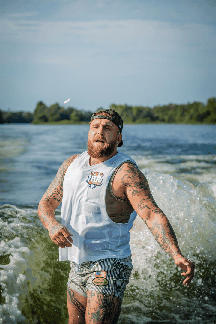 Jake Paul wakesurfing on a lake